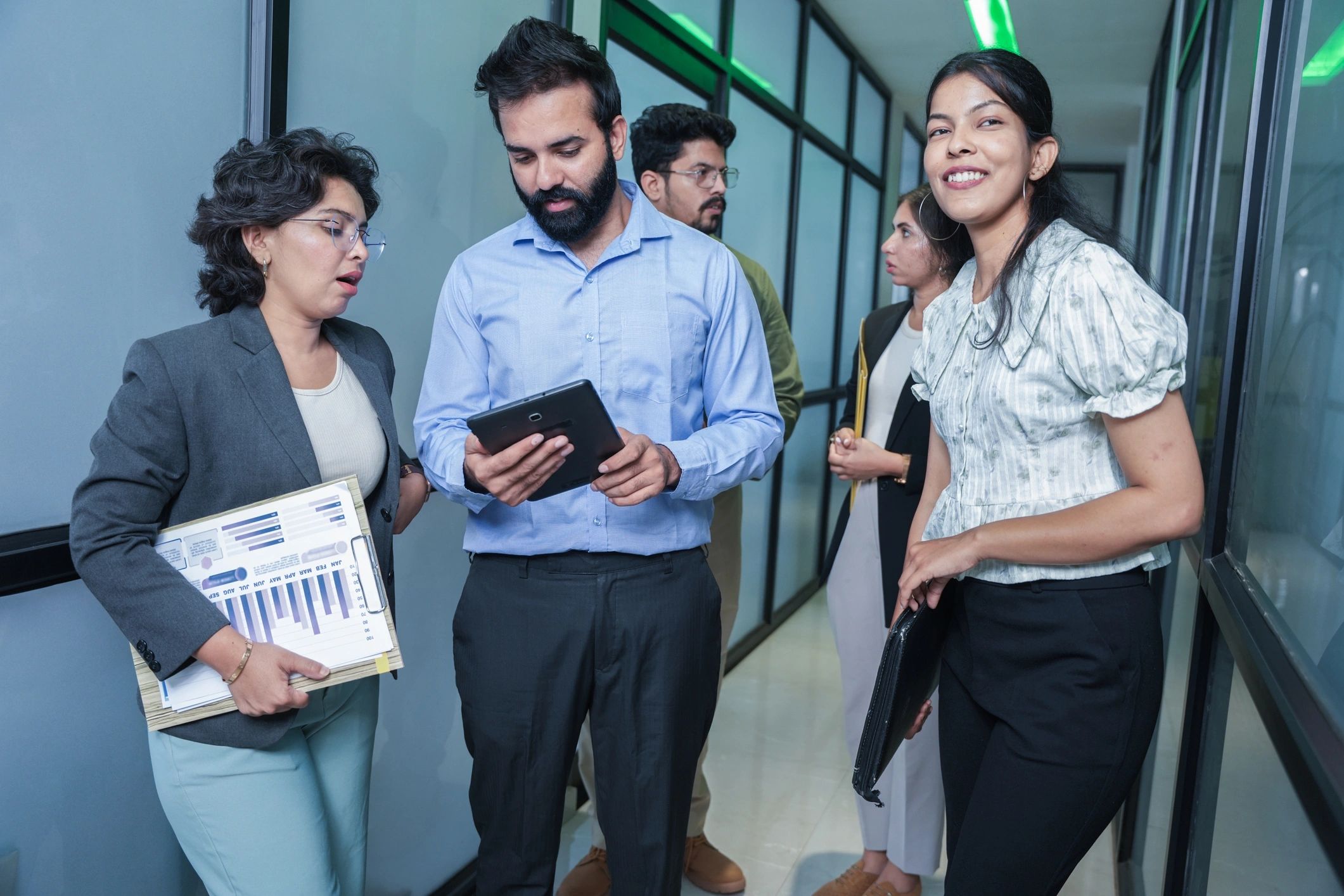 ERP Works consultants discussing requirements in a modern office