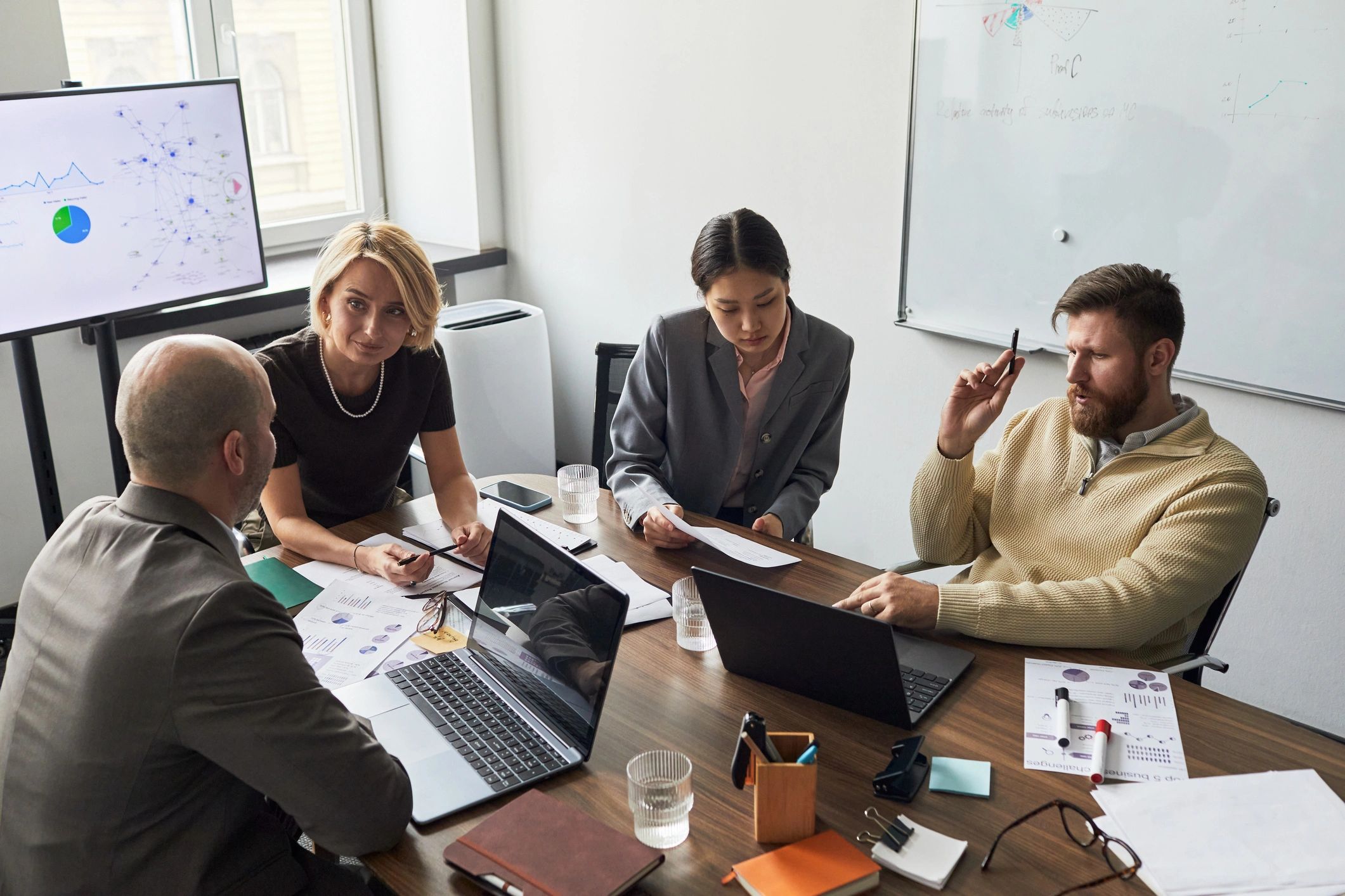 Business team reviewing analytics during strategy meeting